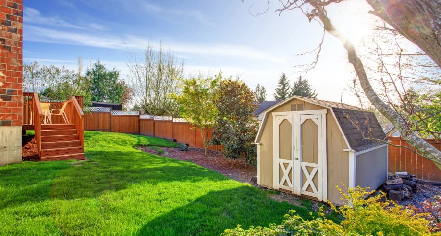 Fenced backyard with storage shed in Madison